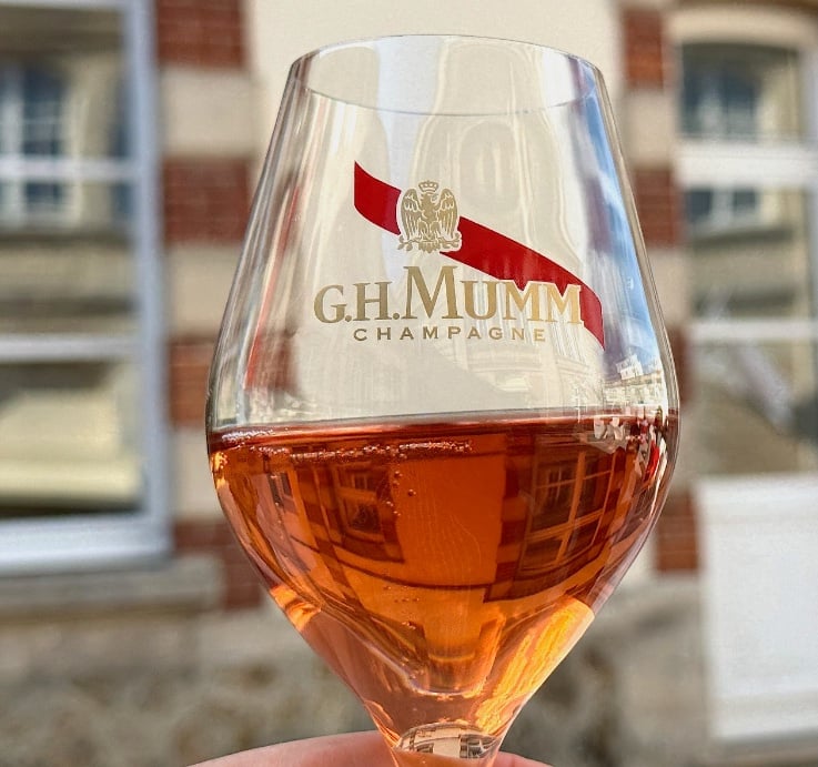 Mumm Champagne glass with red sash © Scott Kendall