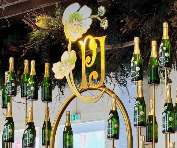 Perrier-Jouet bottles hanging over bar © Scott Kendall