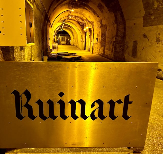 Ruinart brass sign in cellars © Scott Kendall