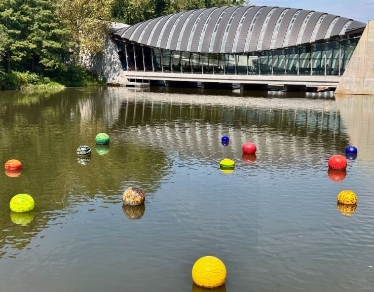 Crystal Bridges with floating Chihuly spheres © Scott Kendall 