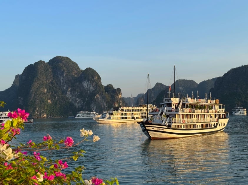 Halong Bay boat among the rocks © Scott Kendall