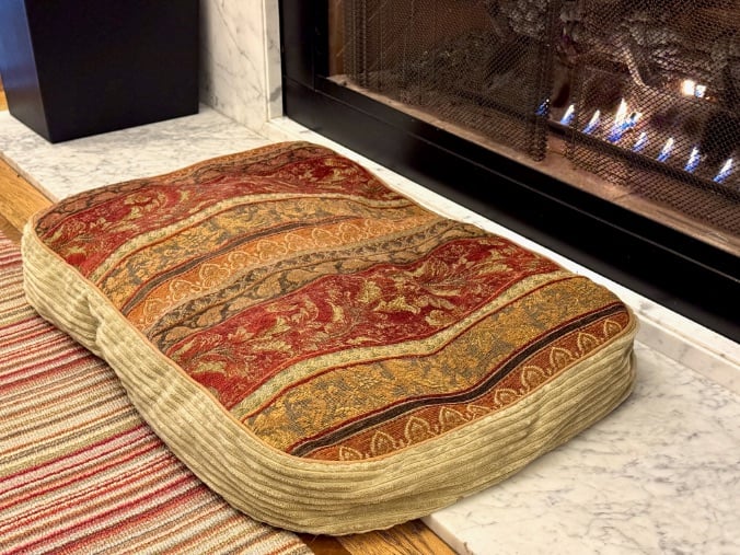 Buddy's Broadmoor dog bed by the fireplace © Scott Kendall 
