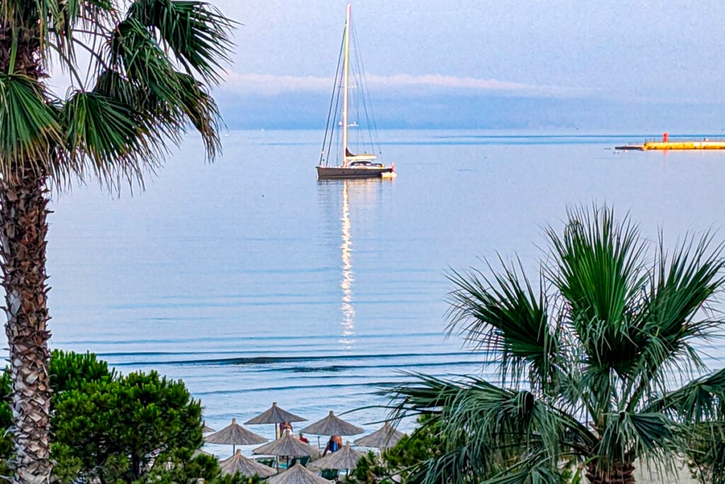 Sailboat off the Lungomare in Vlorë, Albania © Mary Charlebois
