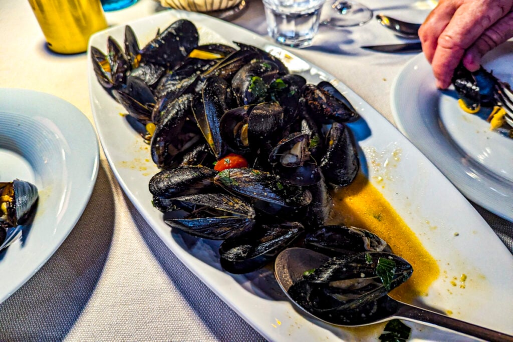 Black Mussels are a specialty of the Albanian Riviera – we devoured these black beauties at Restaurant Ideal on Lungomare © Mary Charlebois