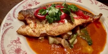 The Majestic Bronzino with flavorful sauce and Cannellini beans © Scott Kendall